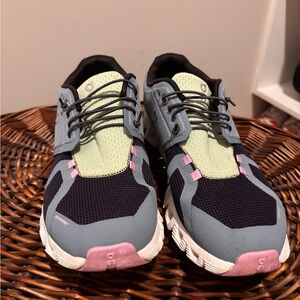 On Running Women's Sneakers in Black, Gray, and Pink